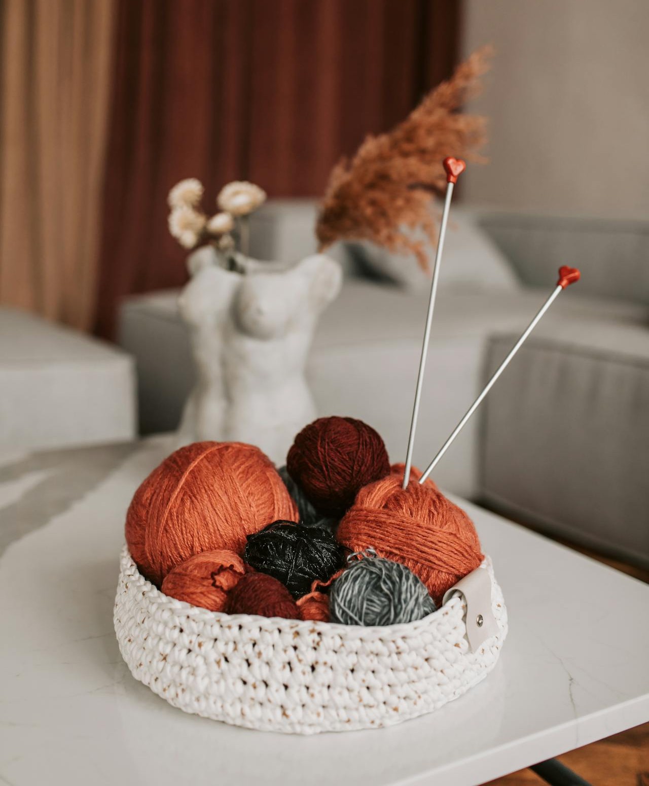 Balls of yarn with knitting needles